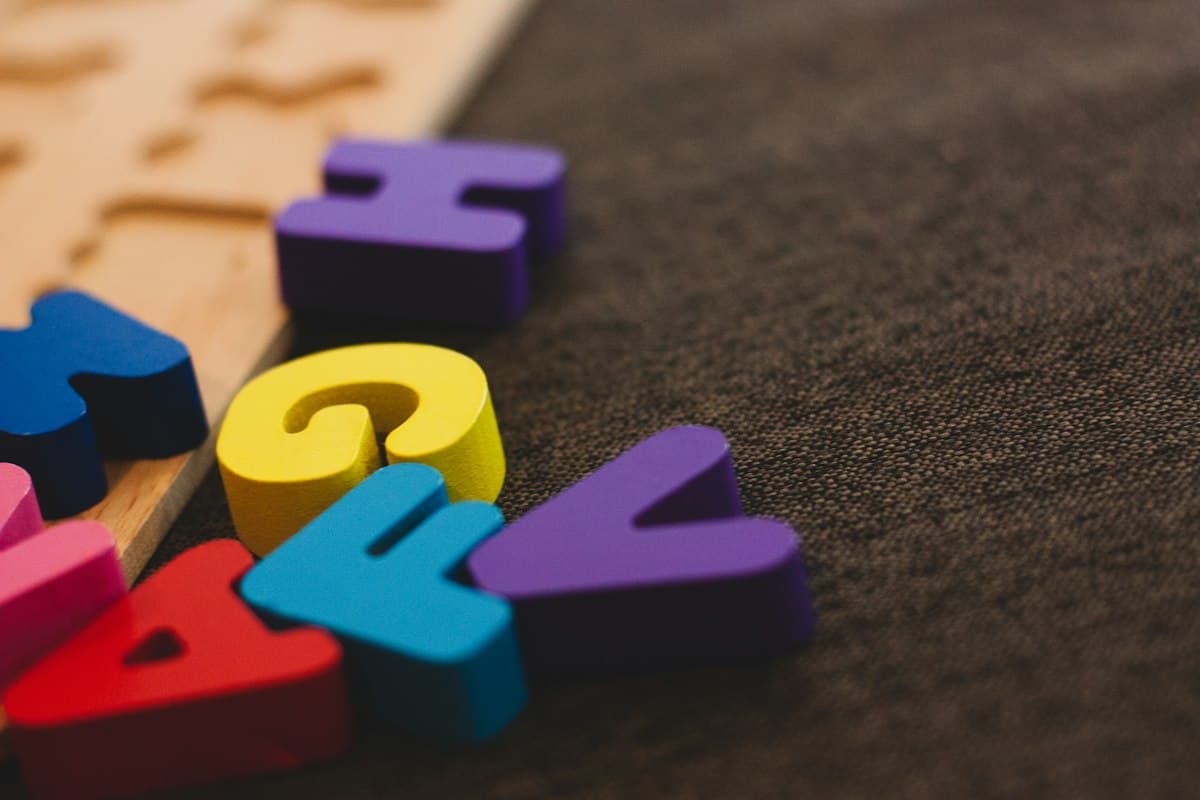 Colourful foam alphabet letters on a table